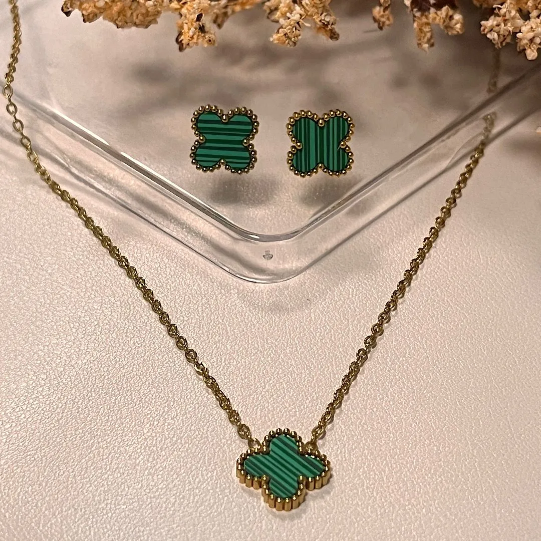 Conjunto em aço dourado Alhambra